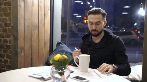 Man is mixing coffee in cafe Video stock 86380991