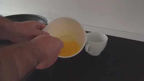 Man mixing egg yolk in kitchen Stock Footage 144954922