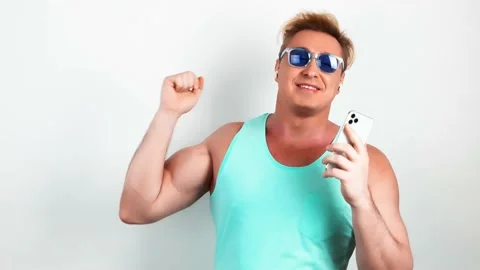 Man, mobile cell phone, dance in headphones Video stock 239455632