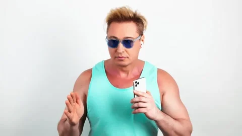 Man, mobile cell phone, dance in headphones for entertainment, streaming service Stock Footage 245571312
