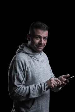 Man with a mobile phone looking at the camera Stock Photos