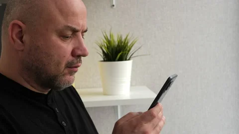 Man with mobile smart phone, side view. Businessman holding smartphone Video stock 239053167
