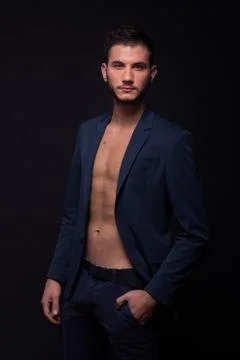 Man model looking at camera shirtless abs fit elegant suit jacket pants 스톡 사진