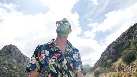 Man modeling in mountain landscape HD 4 Stock Footage 139982943