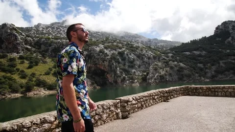 Man modeling in mountain landscape HD 2 Stock Footage 139982946