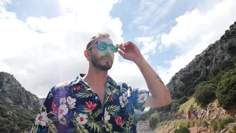 Man modeling in mountain landscape HD 5 Stock Footage 139983012