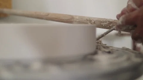 Man modeling plaster cast pottery with ceramic tools slow motion Stock Footage 79837714