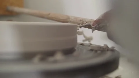 Man modeling plaster cast pottery with ceramic tools slow motion Stock Footage 79837728
