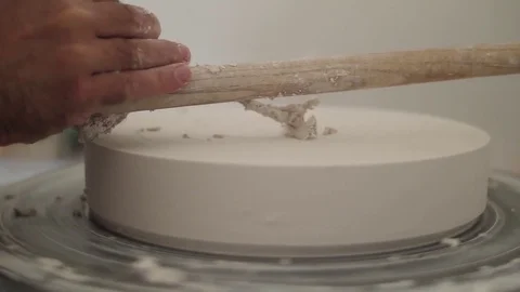 Man modeling plaster cast pottery with ceramic tools slow motion Stock Footage 79837741
