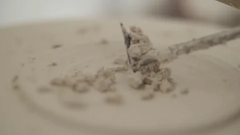 Man modeling plaster cast pottery with ceramic tools slow motion Stock Footage 79837852