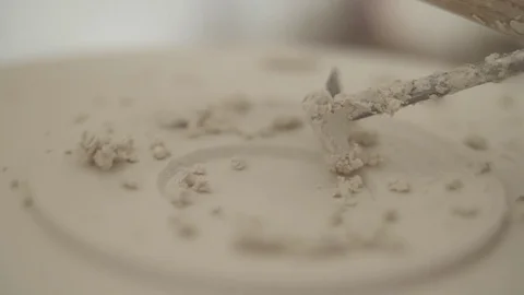 Man modeling plaster cast pottery with ceramic tools slow motion Video stock 79837870
