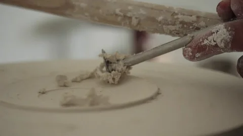 Man modeling plaster cast pottery with ceramic tools slow motion Stock Footage 79837894