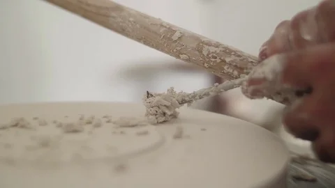 Man modeling plaster cast pottery with ceramic tools slow motion Stock Footage 79837932