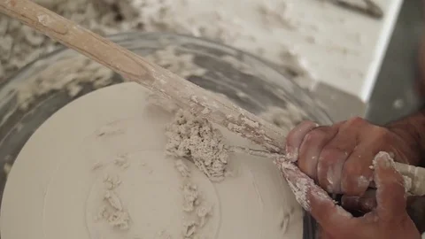 Man modeling plaster cast pottery with ceramic tools slow motion Video stock 79837939