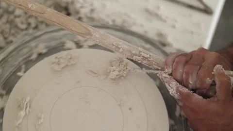Man modeling plaster cast pottery with ceramic tools slow motion Stock Footage 79837942