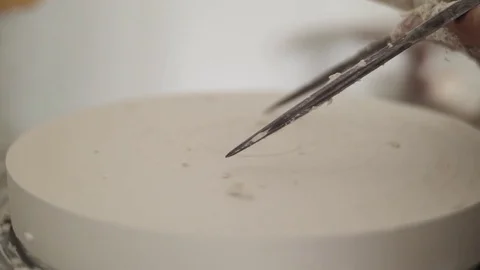 Man modeling plaster cast pottery with ceramic tools slow motion Stock Footage 80021129