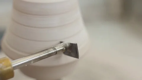 Man modeling plaster cast pottery with ceramic tools slow motion Video stock 80021599