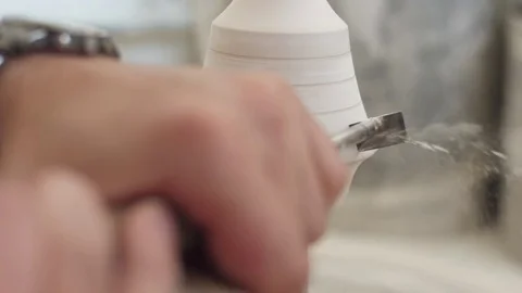 Man modeling plaster cast pottery with ceramic tools slow motion Stock Footage 80021804