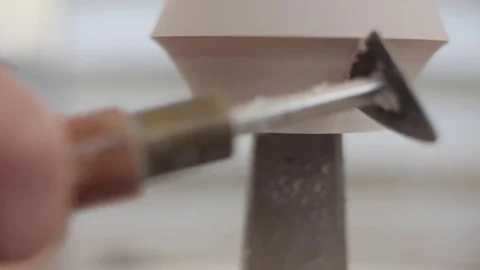 Man modeling plaster cast pottery with ceramic tools slow motion Stock Footage 80022142