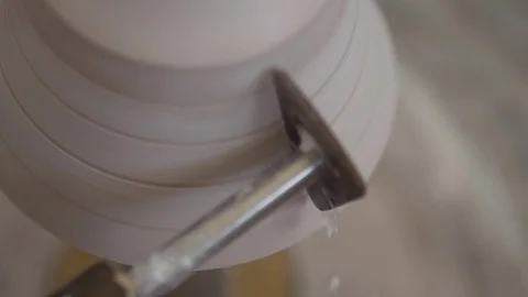Man modeling plaster cast pottery with ceramic tools slow motion Stock Footage 80022163