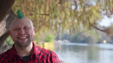 Man with mohawk laughing at camera Stock-Footage 139244236