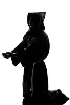 Man monk priest silhouette praying Stock Photos