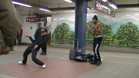 Man moonwalks while another breakdances on NYC platform Video stock 234274809