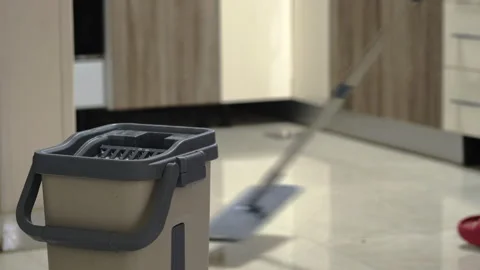Man mopping floor at home Stock Footage 323054581