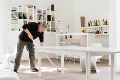 Man mopping the floor Stock Photos