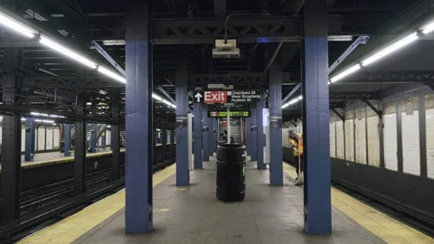 Man Mops Nearly Empty New York Subway Platform During Coronavirus Pandemic 4K Stock Footage 133744136