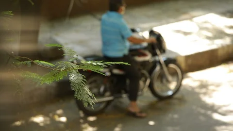 Man-on-motorcycle-blurred 스톡 동영상 129741228