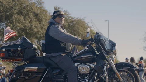 Man on a motorcycle during a parade Stock Footage 100004746
