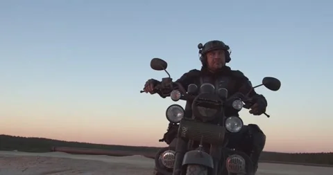 A man on a motorcycle in nature Video stock 157102587