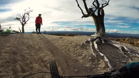 Man Mountain Biking And Taking In View With Wife Stock Footage 114346646