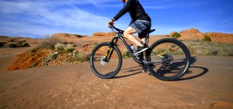 Man Mountain Biking Down Desert Canyon, Utah Trails Stock Footage 109492241