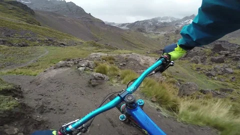 Man Mountain Biking Through High Alpine Trails With Moody Skies Stock-Footage 78250656