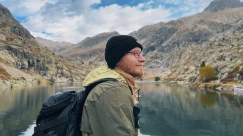 Man by Mountain Lake Stock Footage 320117285