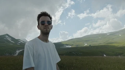Man in mountain meadows Stock Footage 112734622