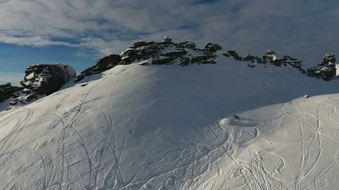 Man on mountain snowmobile races up Video stock 81036487