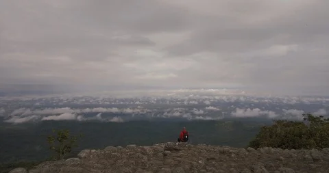 Man on mountain top aerial Stock Footage 89687156