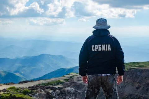 Man on a mountain top Stock Photos