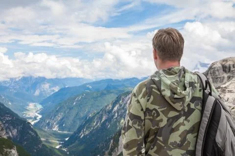 Man in the mountains looking at the horizont Stock Photos
