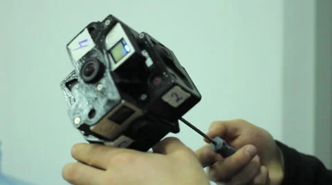 Man Mounting Spherical Camera on the Holder VR gopro 360 Stock Footage 61348948