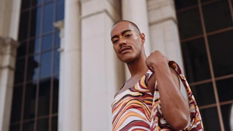 Man With Moustache And Shaved Head In Bright Fashionable Clothing Video stock 170270067