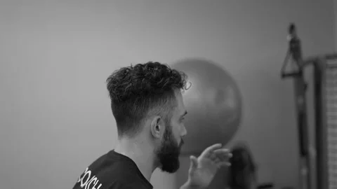 Man moves up and down during workout (Slow B&amp;W) Stock Footage 73136118