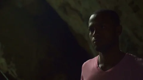 The man moves in a cave by cable car Stock Footage 71287378