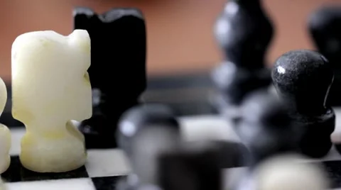 Man moves chess piece Stock Footage 7906778