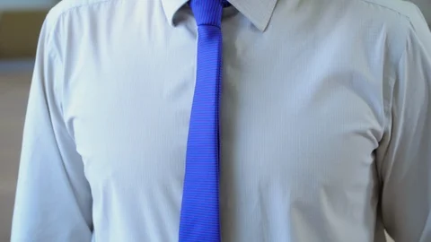 Man moves his glasses while watching in camera Stock Footage 122360432