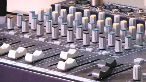 The man moves the sliders on the DJ console Video stock 101679633