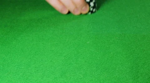 Man moves a stack of black poker chips Stock Footage 58742852